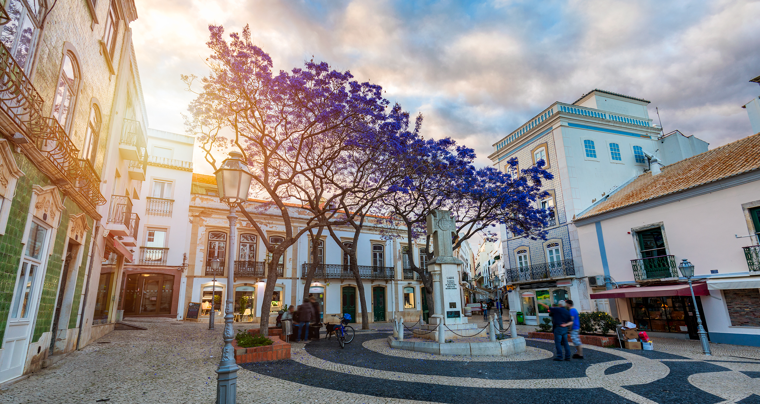 Lagos old town square with evening light and jacaranda trees
